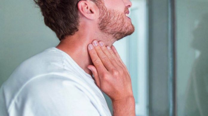 thyroid-self-exam-checkup-young-man-touching-t4-ss-feature-696×390